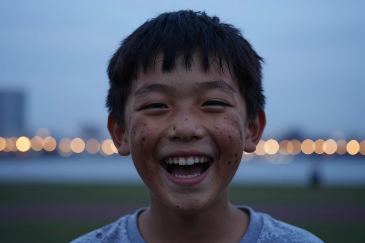 Mud-Splattered Boy Laughing Under String Lights in in Yokohama