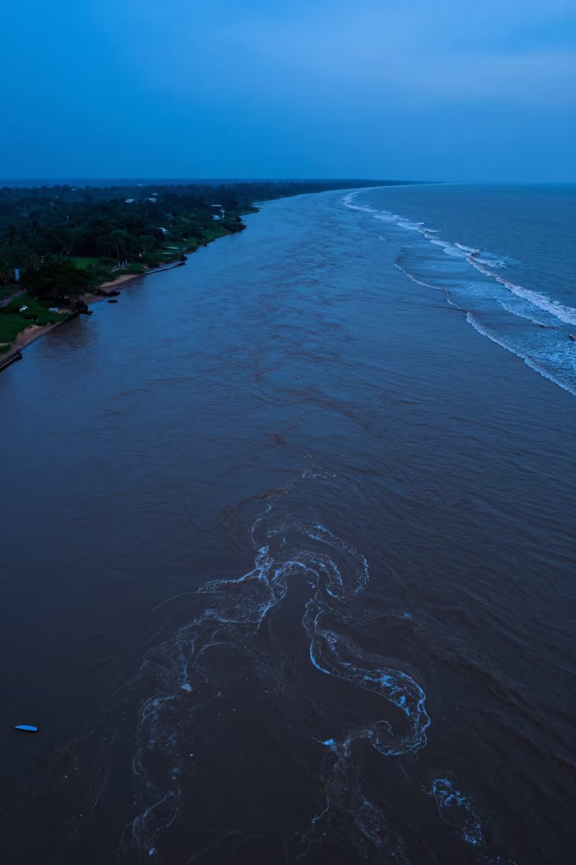 Muddy River Meets Ocean Swirls Mumbai Aerial in far above river meanders near Mumbai