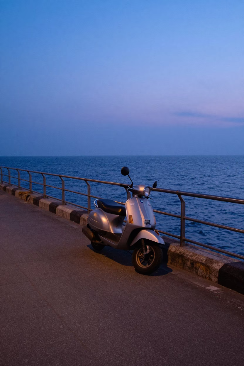 Mumbai Harbor Promenade at Nautical Dawn with Parked Scooter and City Skyline in in Mumbai, India