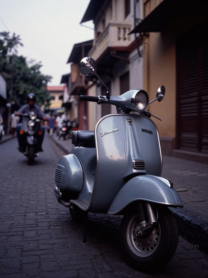 Mumbai India Early Evening Street Scene with Vintage Vespa on Cobblestone Lane in in Mumbai, India