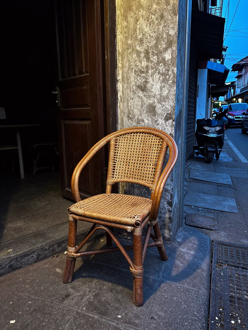 Mumbai India Evening Street Scene with Rattan Chair and Rusty Tiles in in Mumbai, India