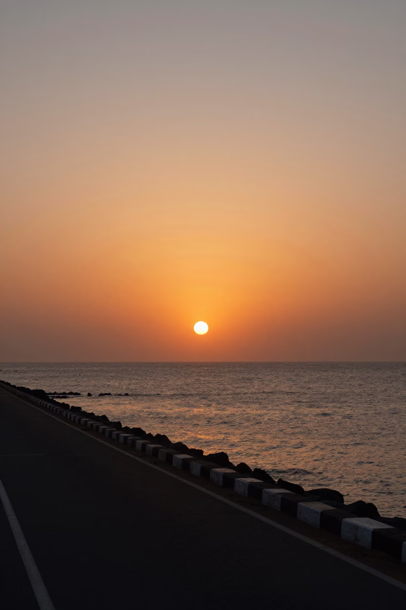 Mumbai Sunset Horizon View of Arabian Sea with Coastal Road Traffic and Palm Trees in in Mumbai, India