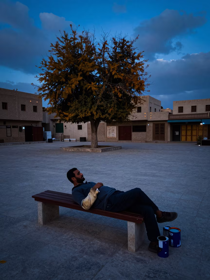 Muralist Resting at Wadi Al-Seer Blue Hour in at a public square in Wadi Al-Seer