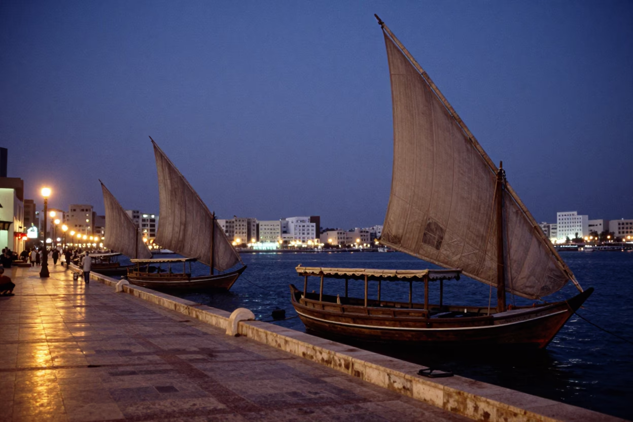 Muscat Oman Evening Street Scene with Traditional Dhow Boats and City Lights in in Muscat, Oman