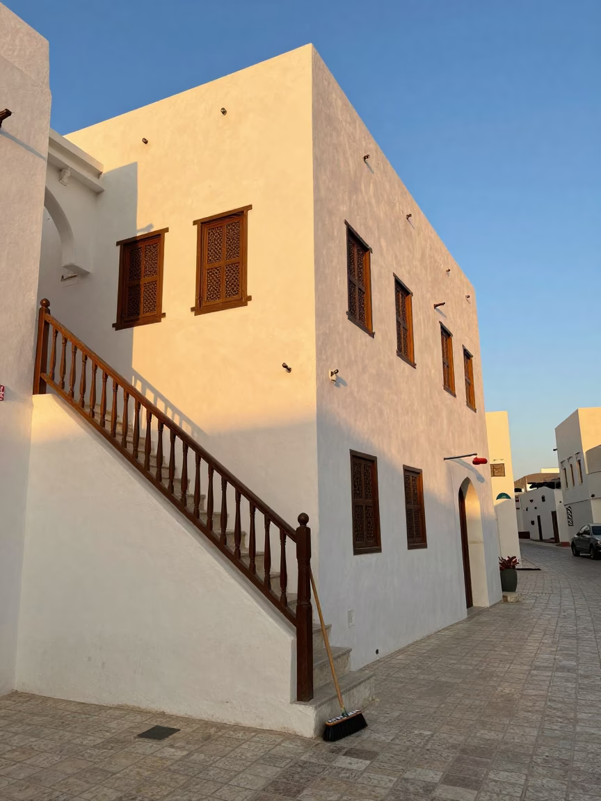 Muscat Oman Golden Hour Street Scene with Stair Rail and Scrub Brush in in Muscat, Oman