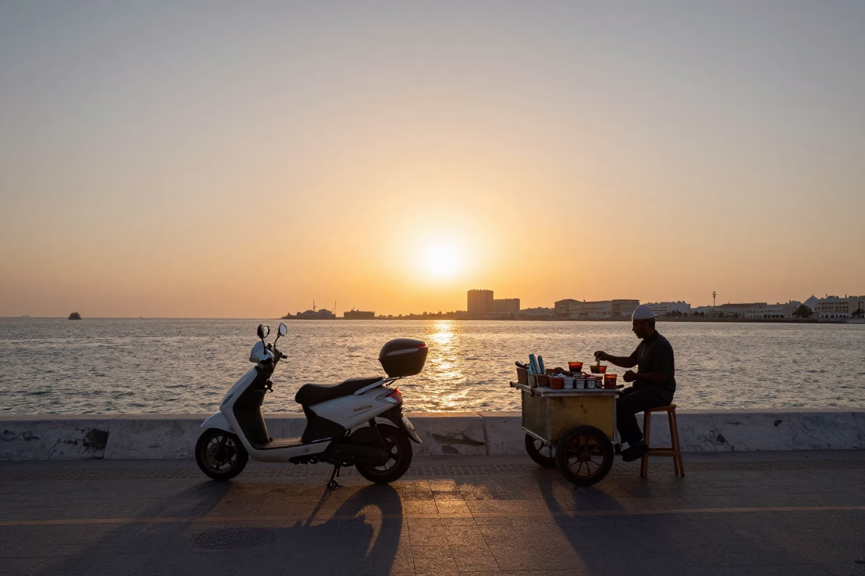 Muscat Oman Harbor Promenade Sunset Scooter and Street Vendor Tea Stains in in Muscat, Oman