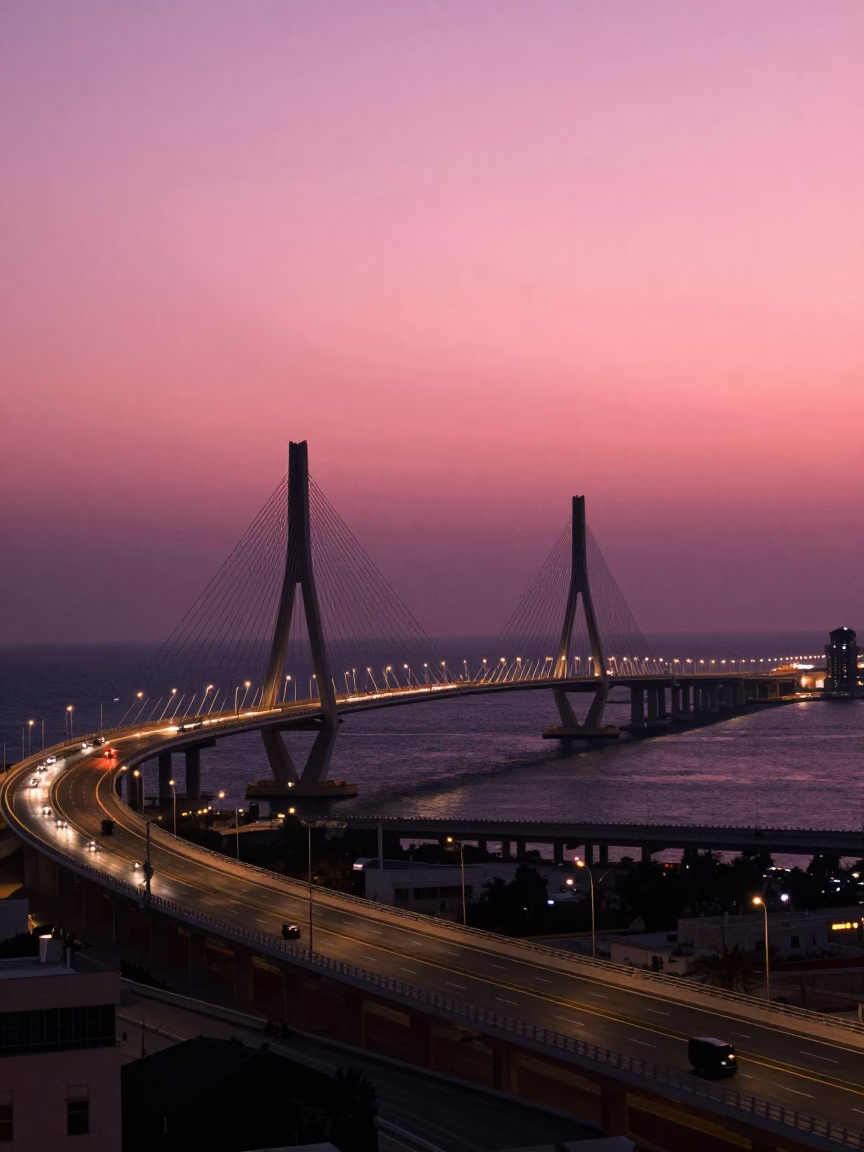 Muscat Oman Highway Flyover Against Pink Evening Sky with Cable-Stayed Bridge Illumination in in Muscat, Oman