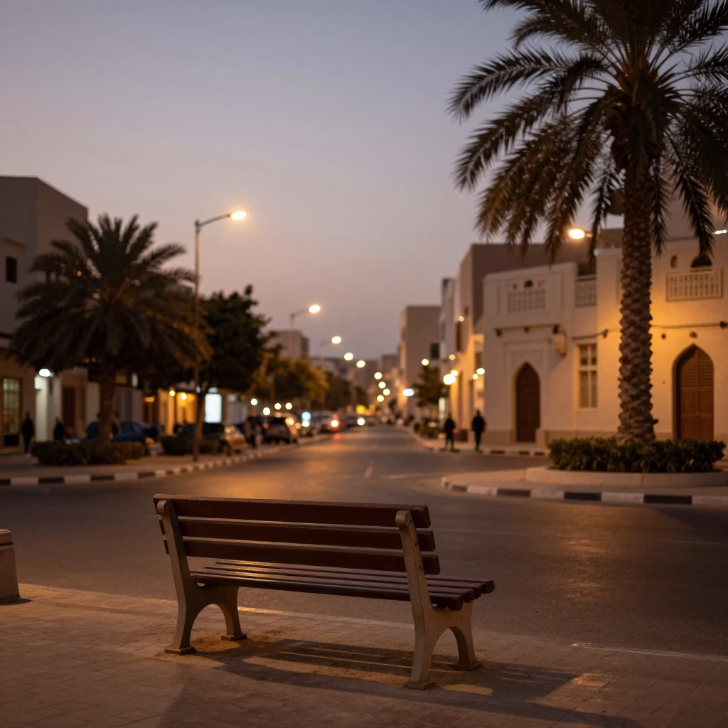 Muscat Oman Street Scene at Dusk with Park Bench and Traditional Architecture in in Muscat, Oman
