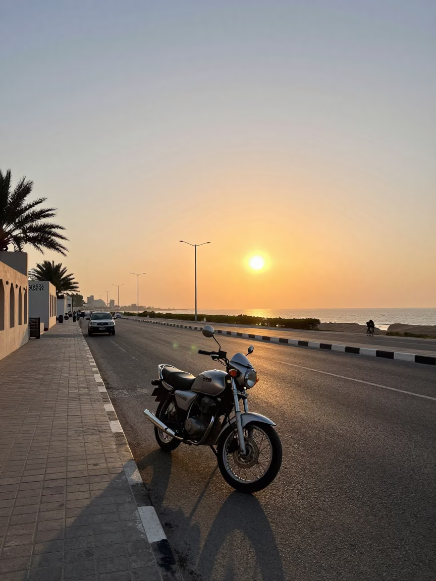 Muscat Oman Sunset Street Scene with Motorcycle and Traditional Architecture in in Muscat, Oman