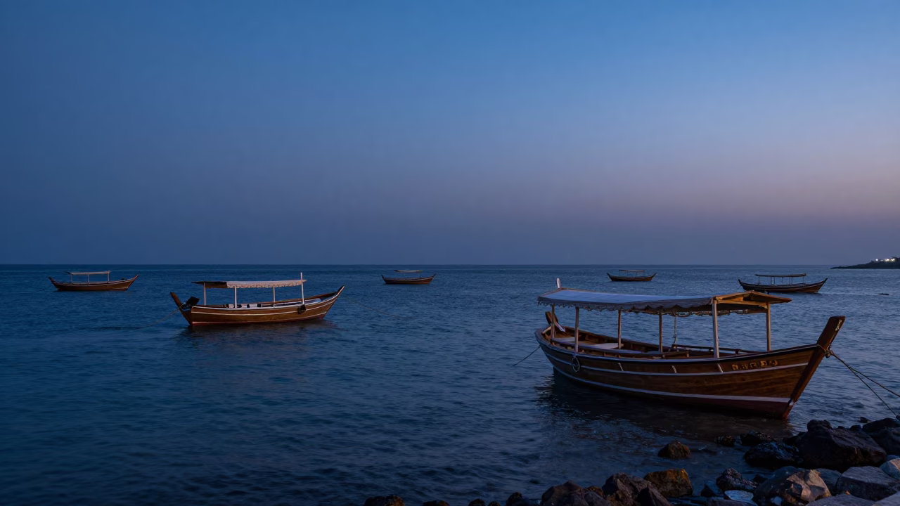 Muscat Oman Twilight Horizon View with Coastal Dhow Boats and Traditional Architecture in in Muscat, Oman