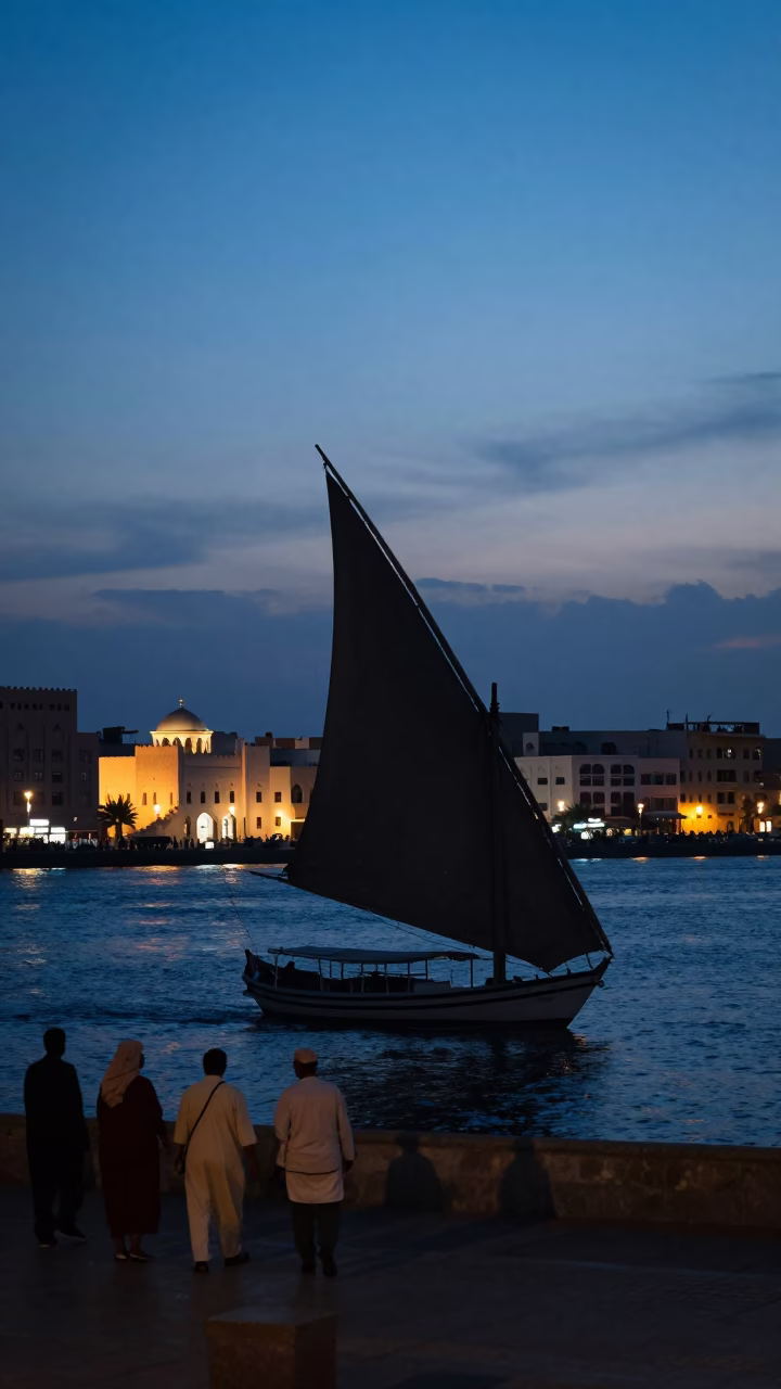 Muscat Oman twilight street scene with dhow silhouette and local life in in Muscat, Oman