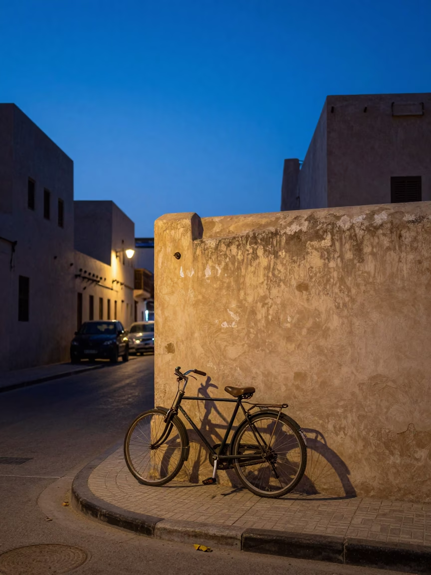 Muscat Oman Twilight Street Scene with Vintage Bicycle and Folding Tables in in Muscat, Oman