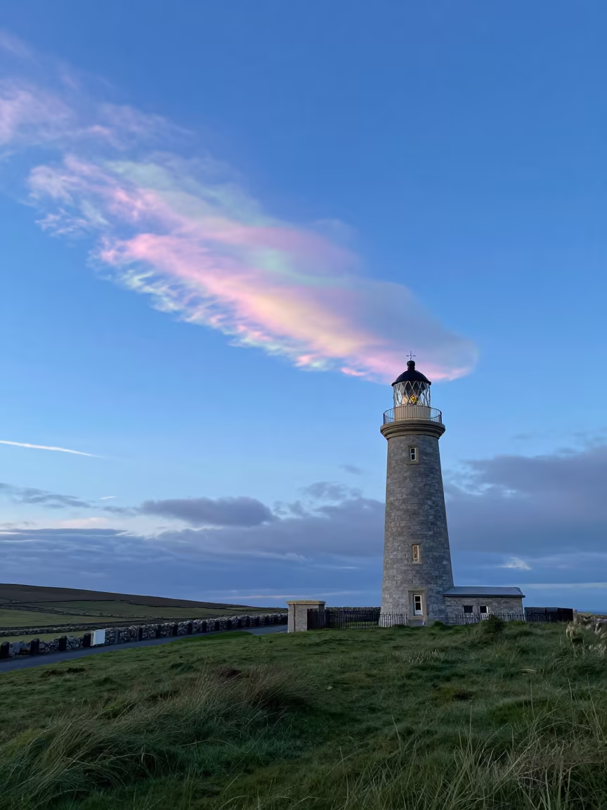 Nacreous Cloud Over Irish Lighthouse Twilight in across a storm-bright plain in Ireland