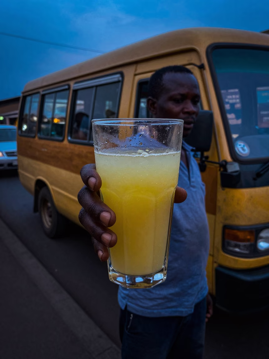 Nairobi Kenya street vendor selling fresh sugarcane juice in predawn darkness in in Nairobi, Kenya