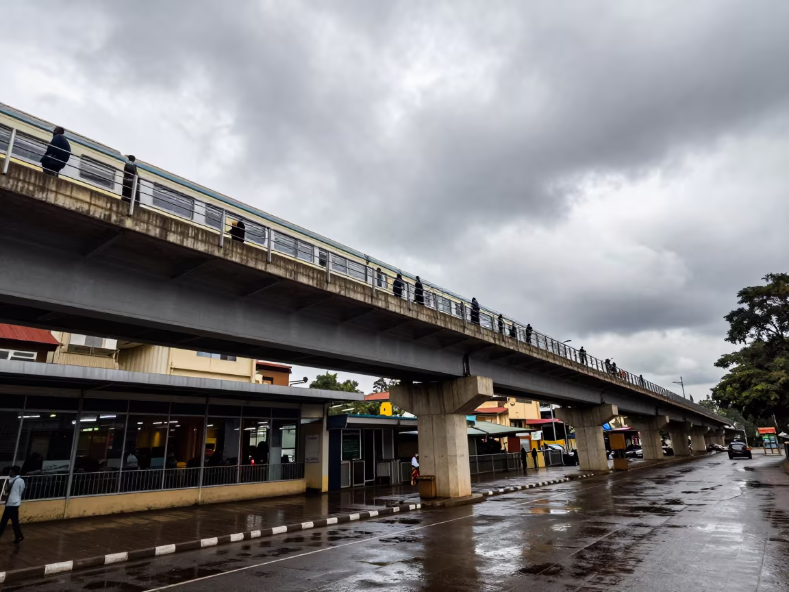 Nairobi Overpass Commuters Under Grey Wet Sky in under an elevated train line in Nairobi