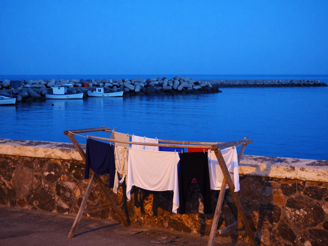 Naples Harbor Blue Hour Before Sunrise with Drying Laundry and Fishing Gear in in Naples, Italy