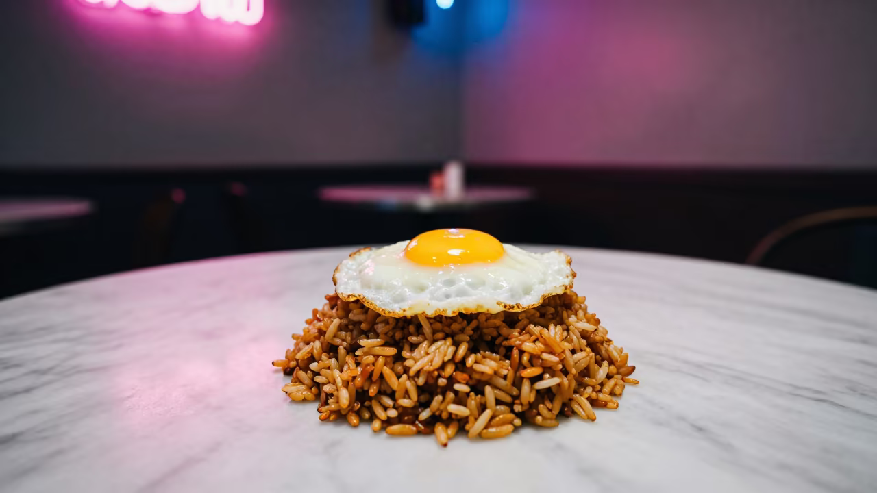 Nasi Goreng and Fried Egg on Marble Table in on a marble cafe table in Kaunas