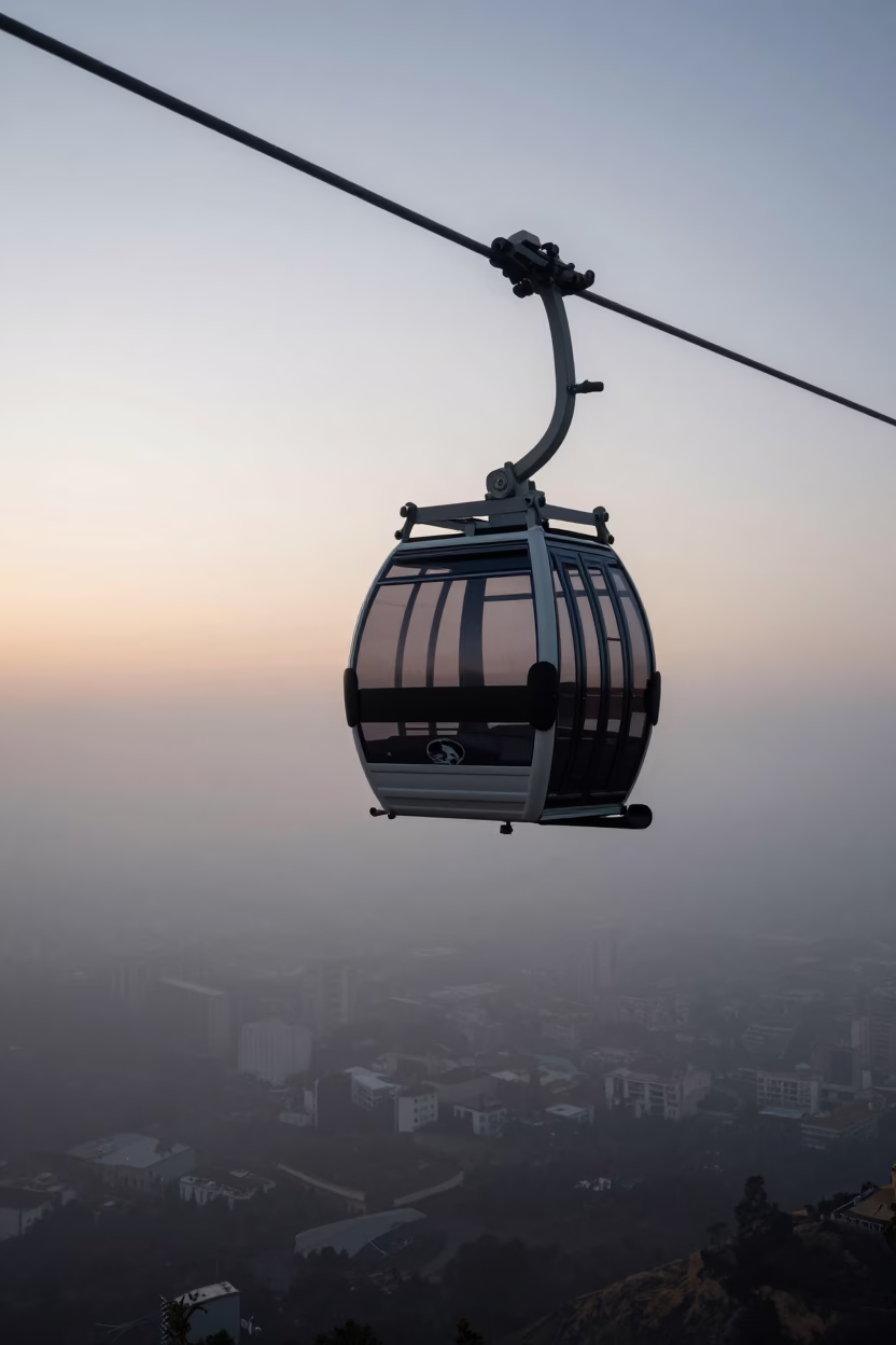 Nautical Dawn Aerial Tramway Gondola Above Morning Fog in Valencia Spain in in Valencia, Spain