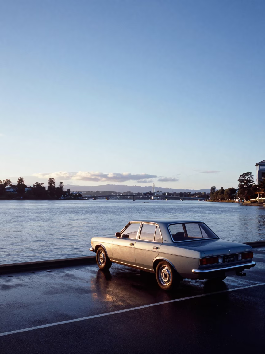 Nautical Dawn at Hobart Waterfront with Vintage Car and Distant Sailing Vessel in in Hobart, Tasmania, Australia