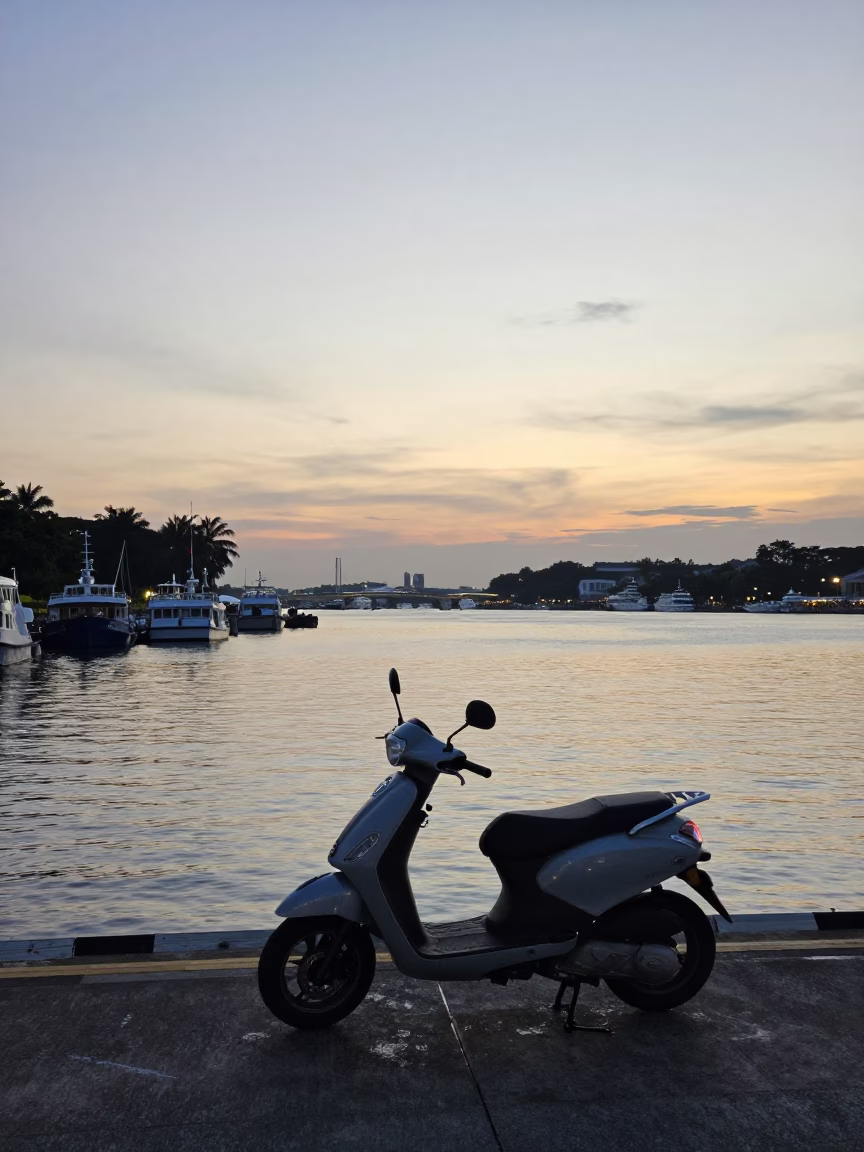 Nautical Dawn Horizon Shot of Singapore Harbor with Scooter and Peg Rails in in Singapore, Singapore