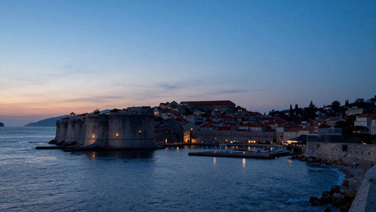 Nautical Dawn in Dubrovnik Croatia showing historic city walls and calm Adriatic sea water in in Dubrovnik, Croatia