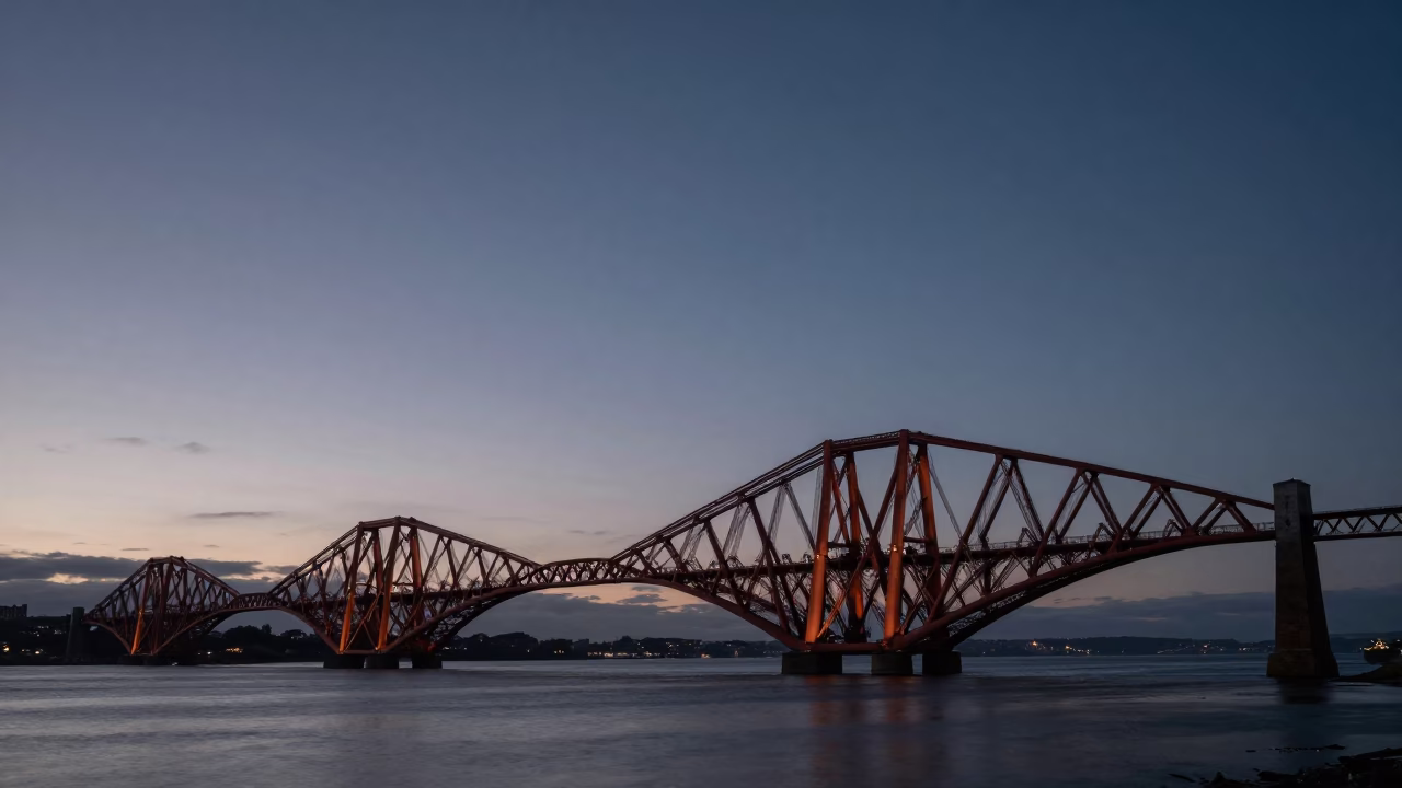 Nautical Dawn in Edinburgh UK with Cable Stayed Bridge Illuminated Against Dark Harbor Water in in Edinburgh, United Kingdom