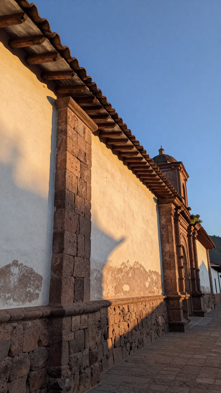 Nautical Dawn Light on Colonial Cusco Stone Walls with Leaf Shadows in in Cusco, Peru