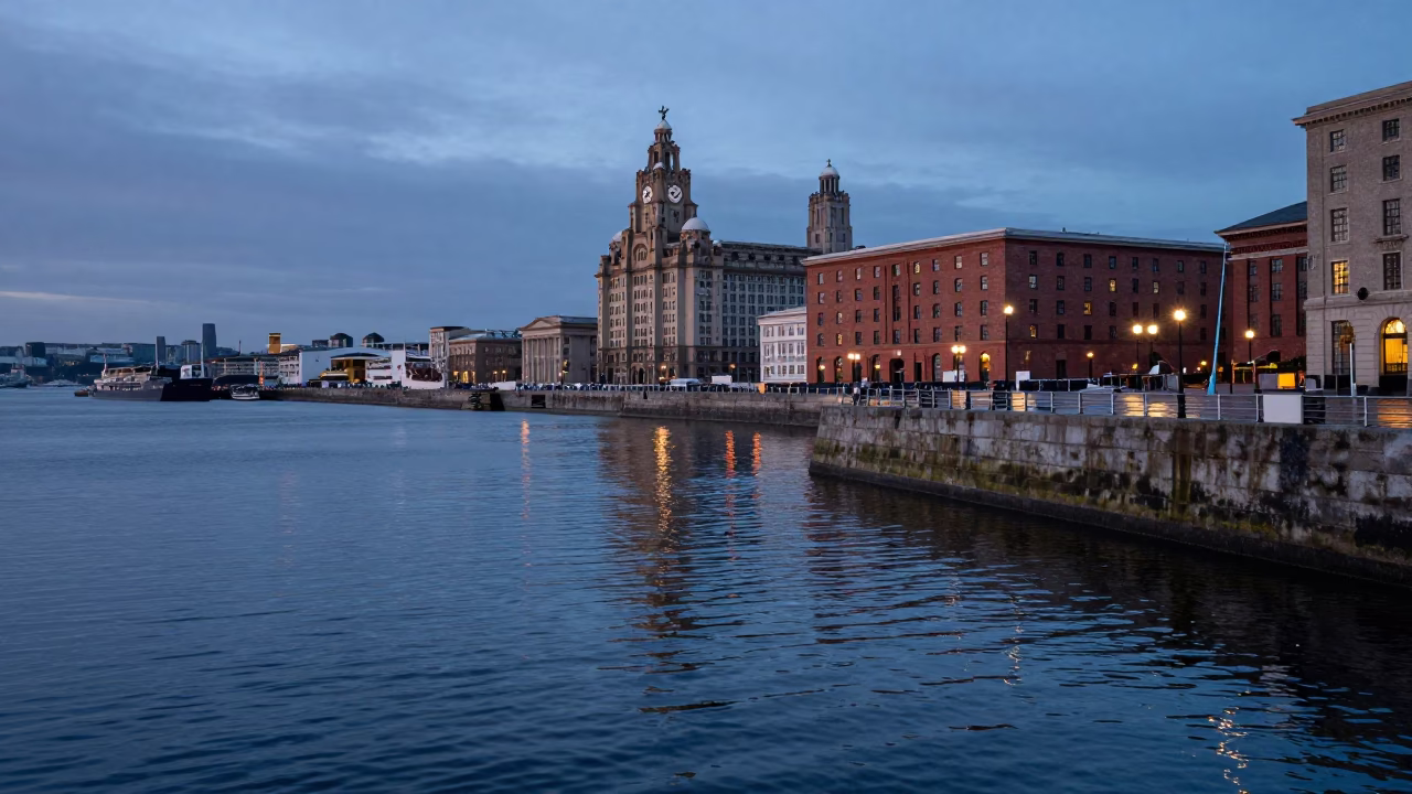 Nautical Dawn Light Reflecting on Liverpool Docks Water and Stone Embankment in in Liverpool, United Kingdom