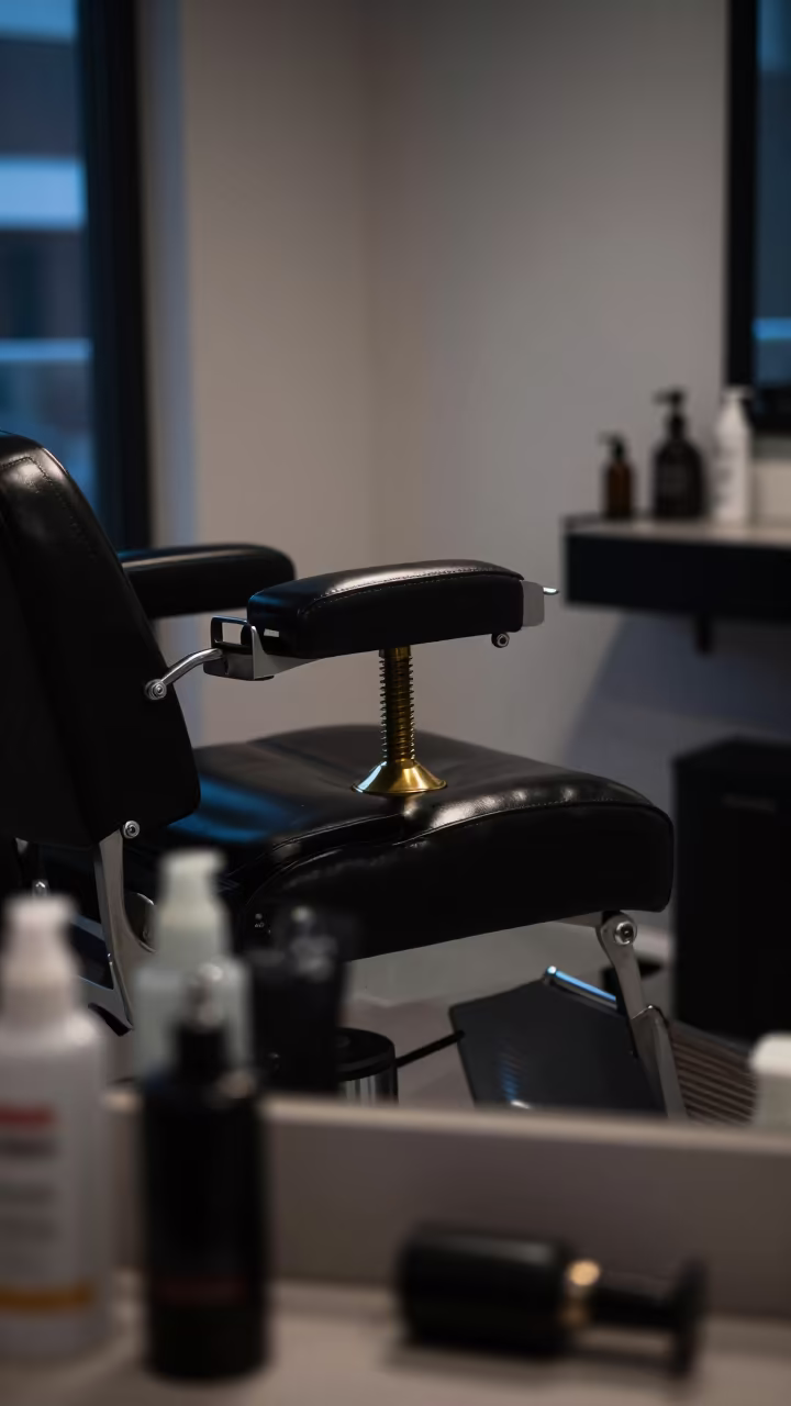 Neon-lit Barber Chair Footrest in Predawn Skincare Room in inside a skincare treatment room in Minneapolis