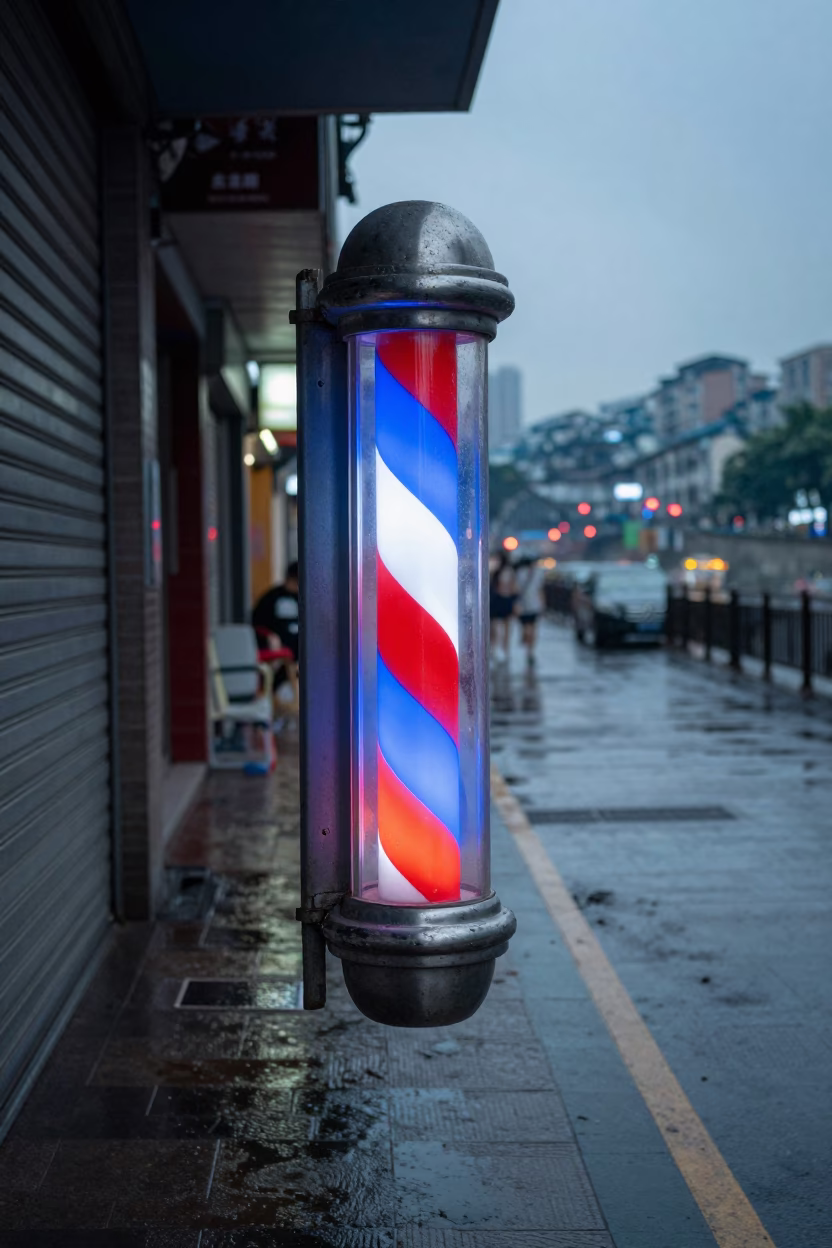Neon Barber Pole Above Wet Chongqing Street in along a shuttered arcade in Chongqing