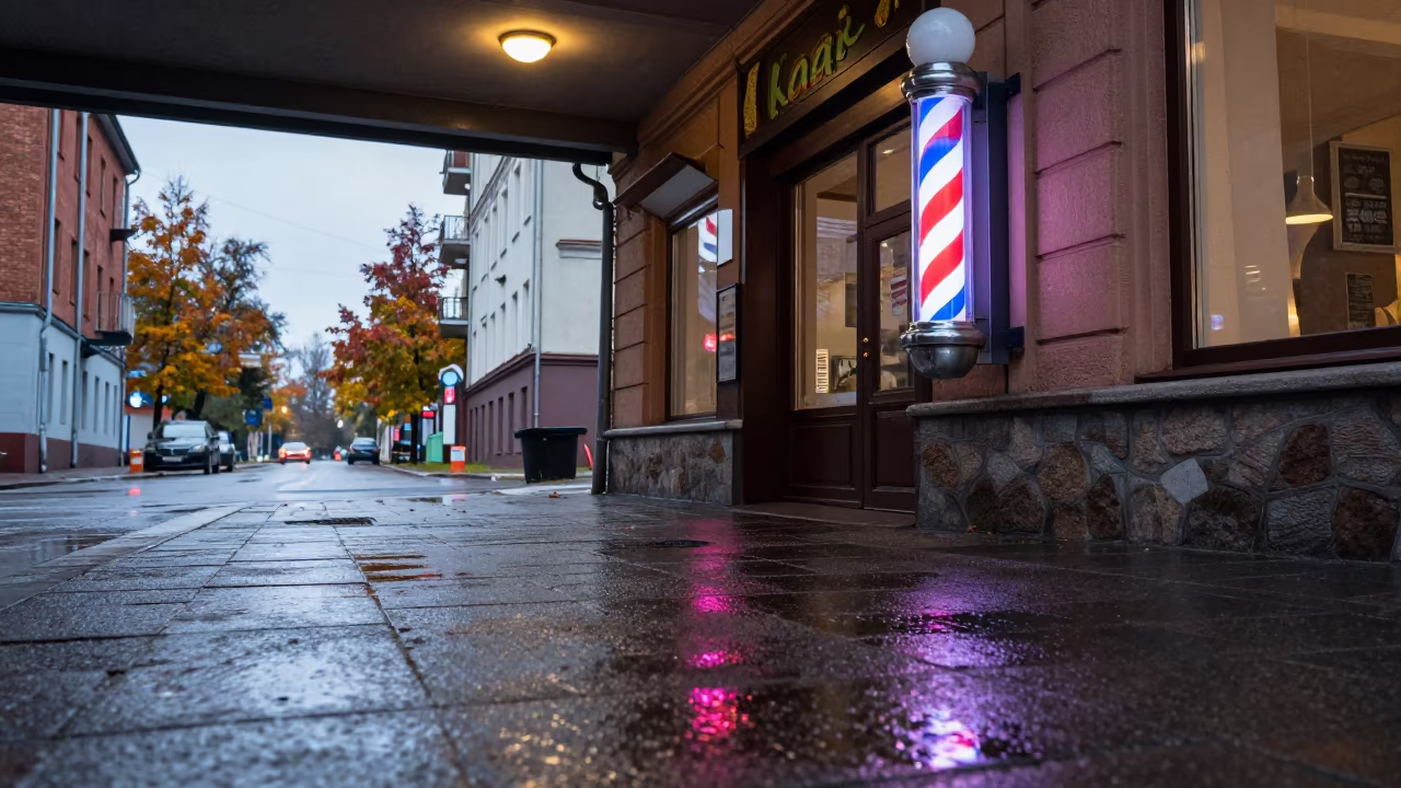 Neon Barber Pole Glowing Over Wet Kaunas Street in beneath a flickering underpass light in Kaunas