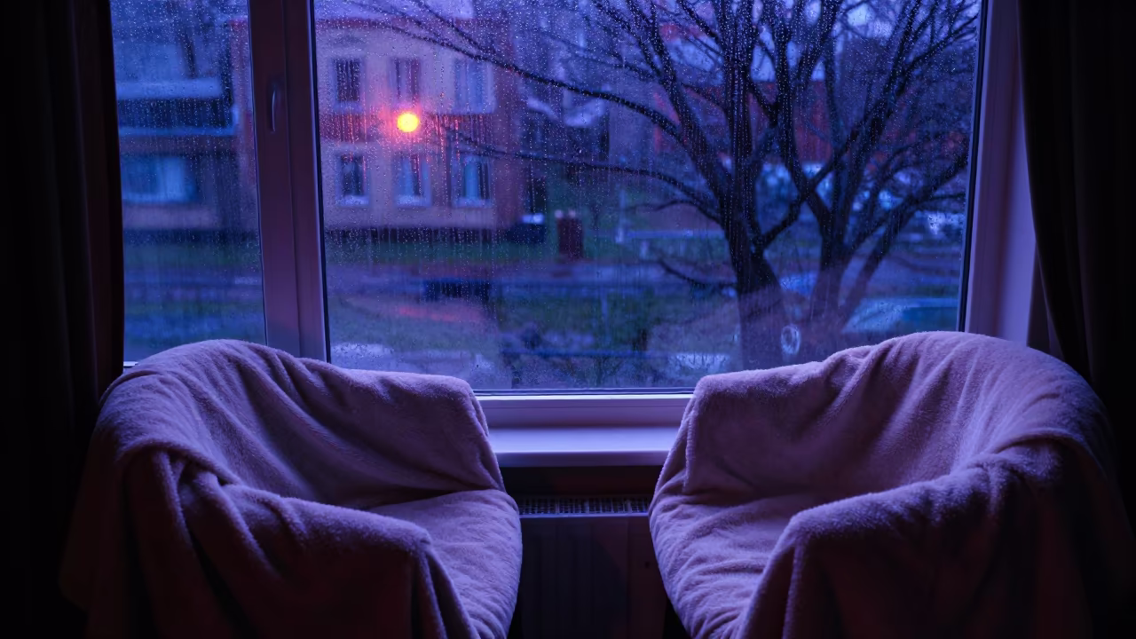 Neon Lit Blanket Tent Night Odessa in beside a rain-streaked window near Odessa