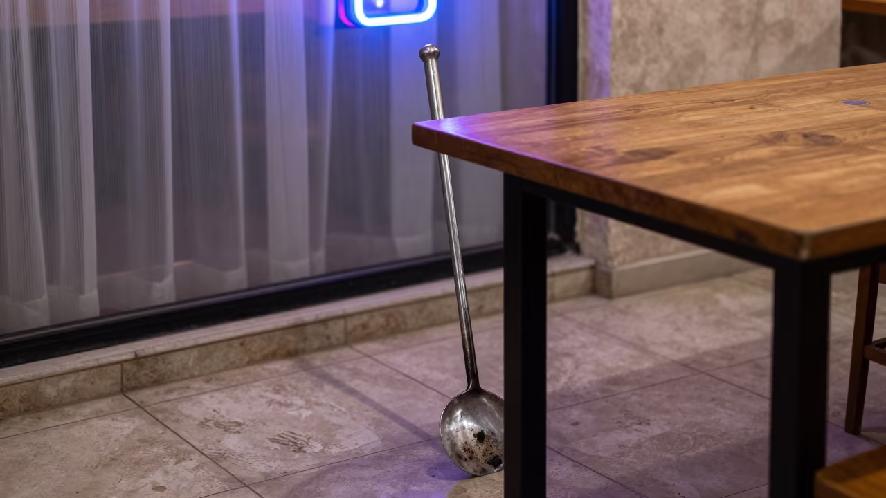 Neon Lit Fireplace Poker on Cafe Table in on a cafe table by a window in Aqaba