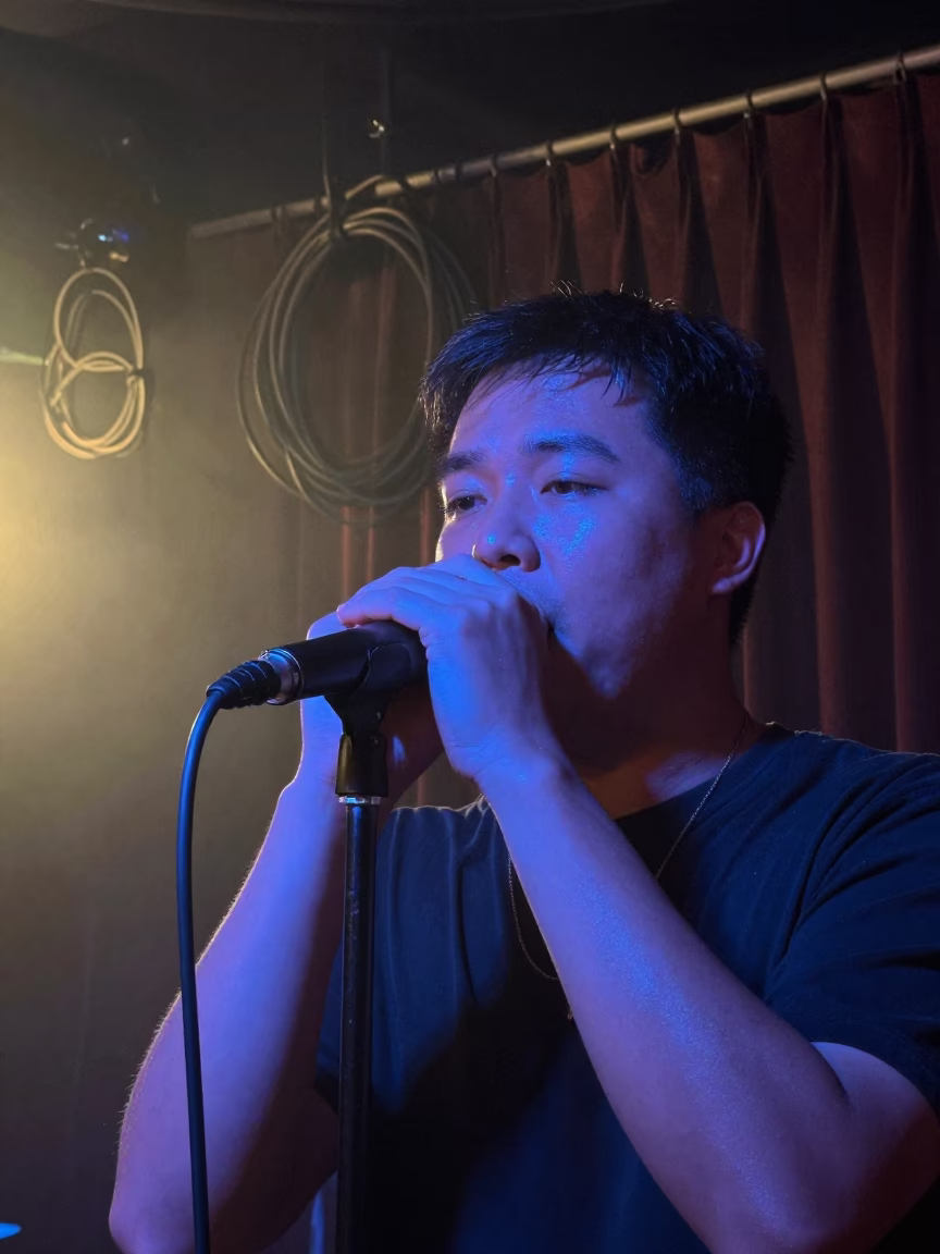 Neon Lit Harmonica Player in Desouk Juke Joint in on a dimly lit stage in Desouk
