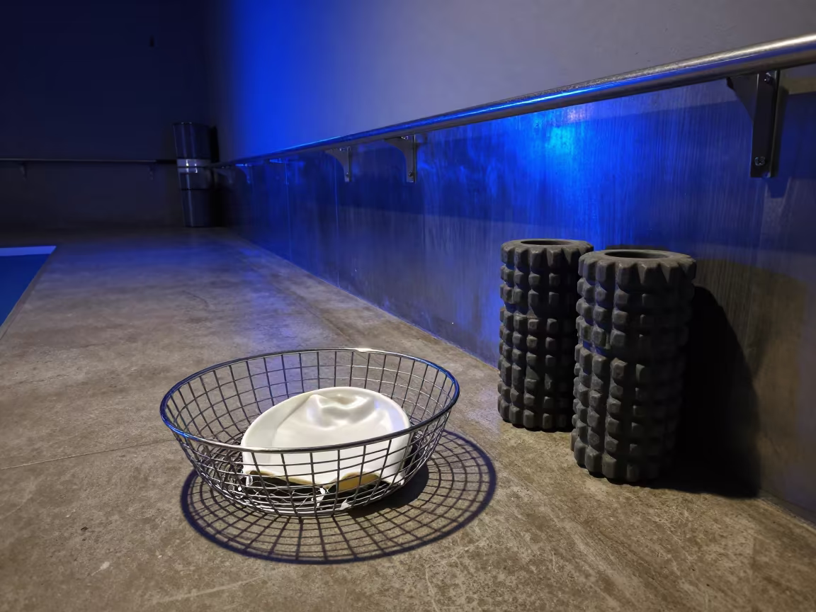 Neon Lit Swim Cap Basket in Quiet Night Lounge in inside a recovery lounge beside foam rollers in Obninsk