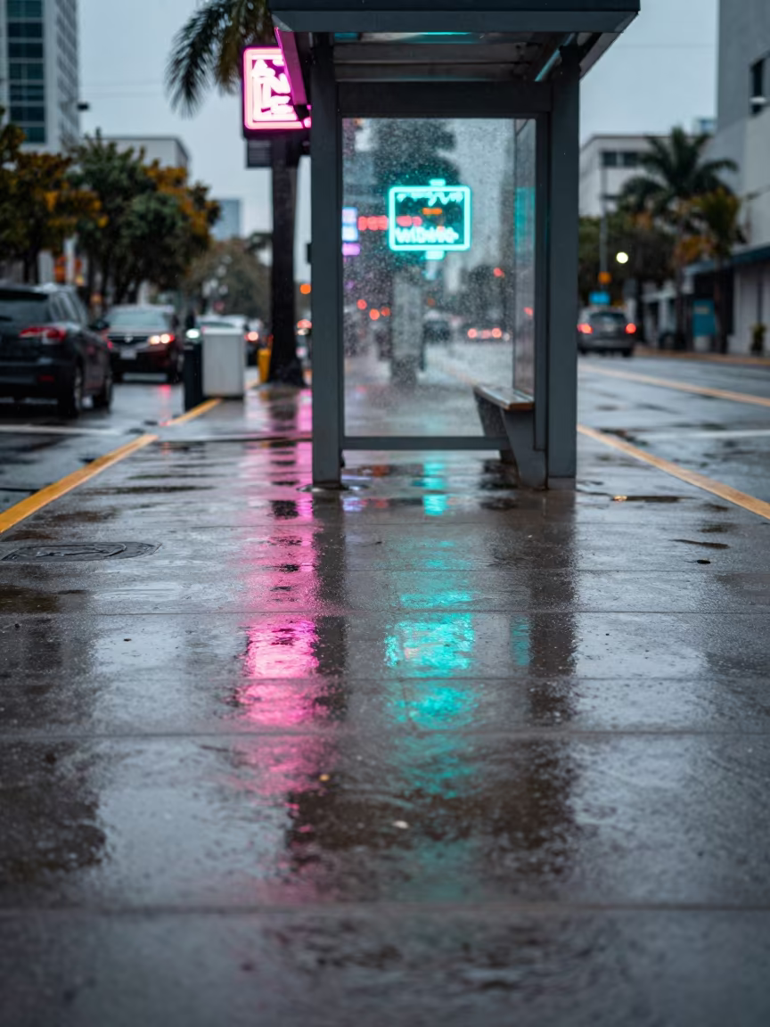 Neon Reflections in Rain on Miami Asphalt in at a tram stop in Miami