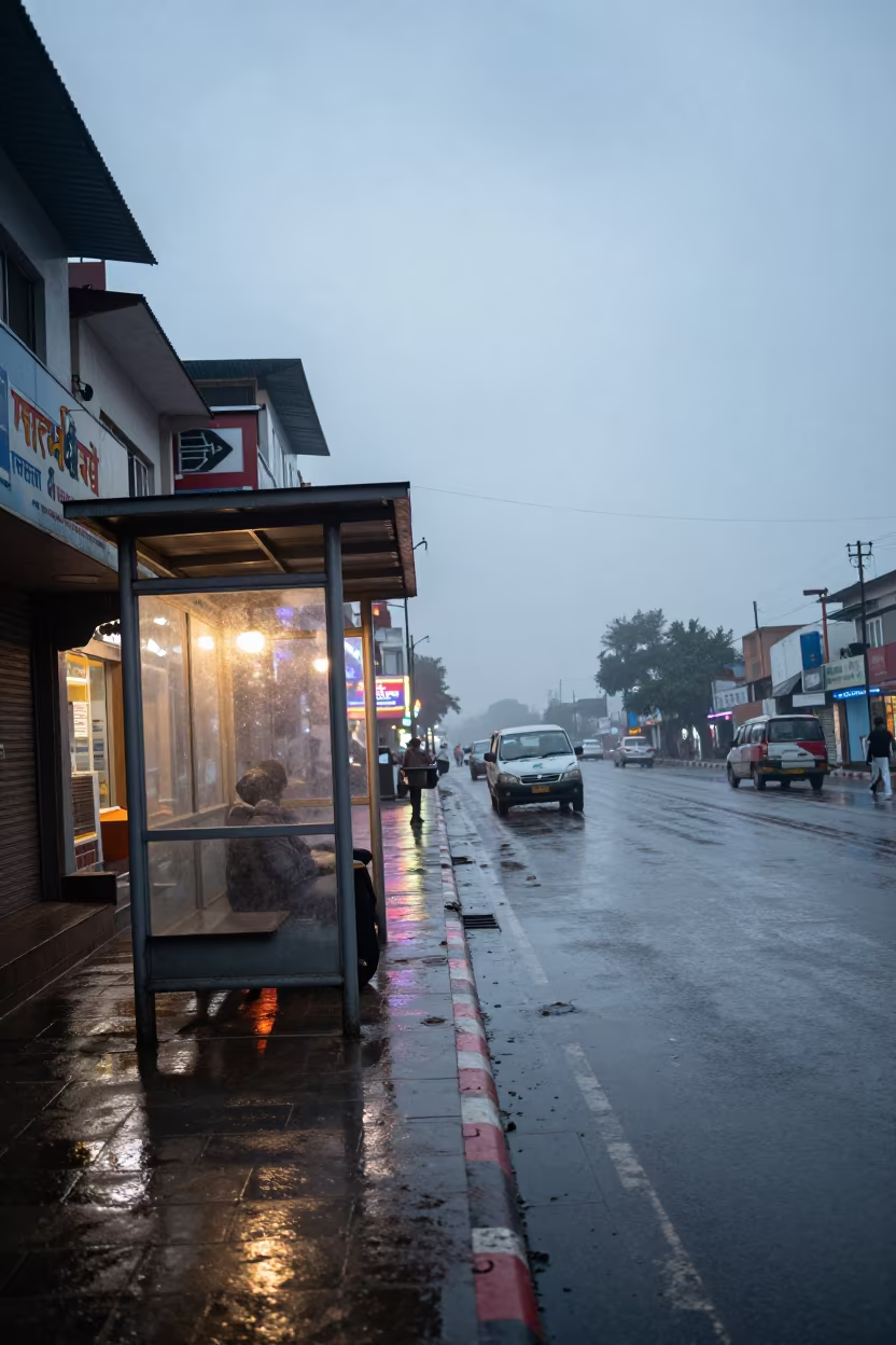 Neon Reflections on Rainy Bahawalnagar Pavement in beside a steamed-up bus shelter in Bahawalnagar