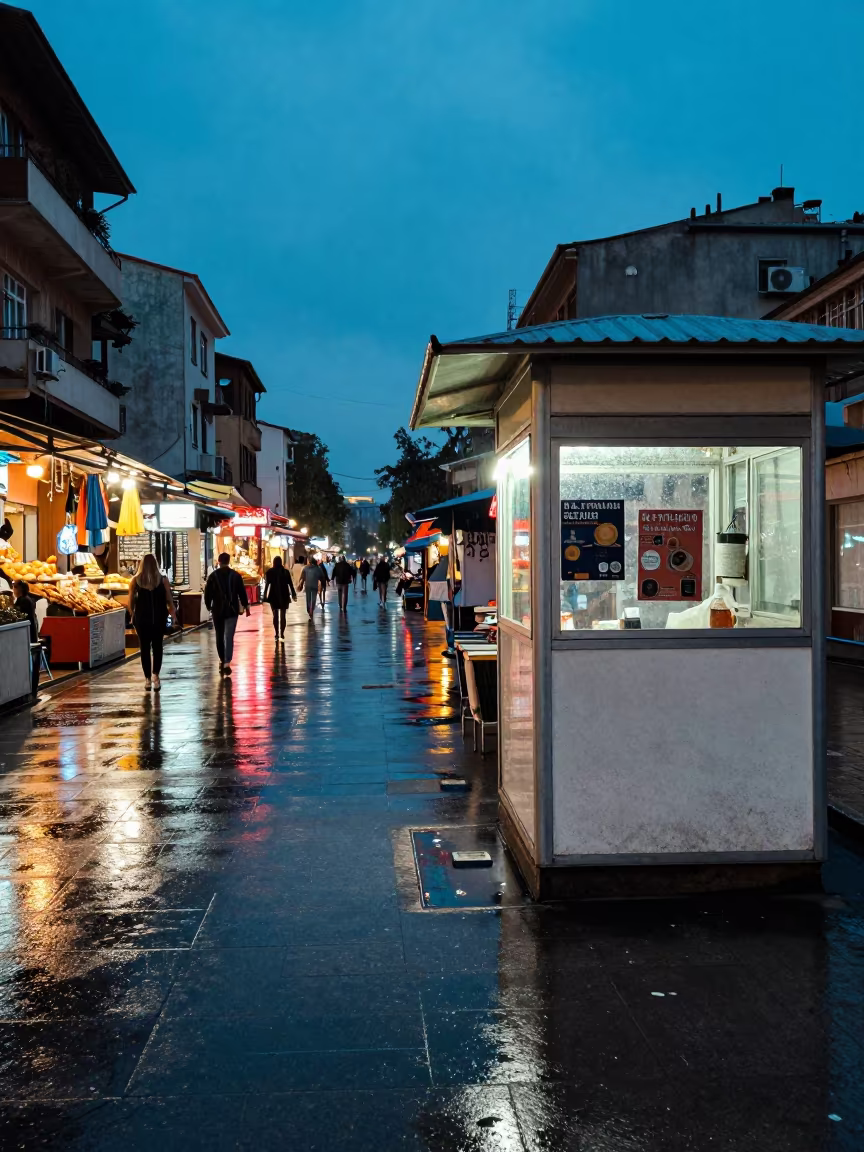 Neon Spill on Wet Ankara Street at Twilight in along a market-lined side street in Ankara