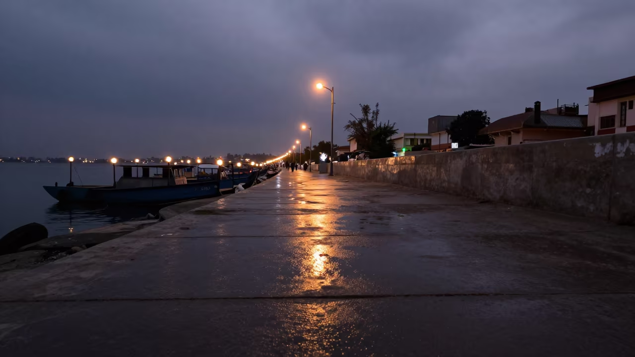 Neon Spill on Wet Sidewalk at Rawalpindi Harbor in beside a lantern-dotted harbor near Rawalpindi