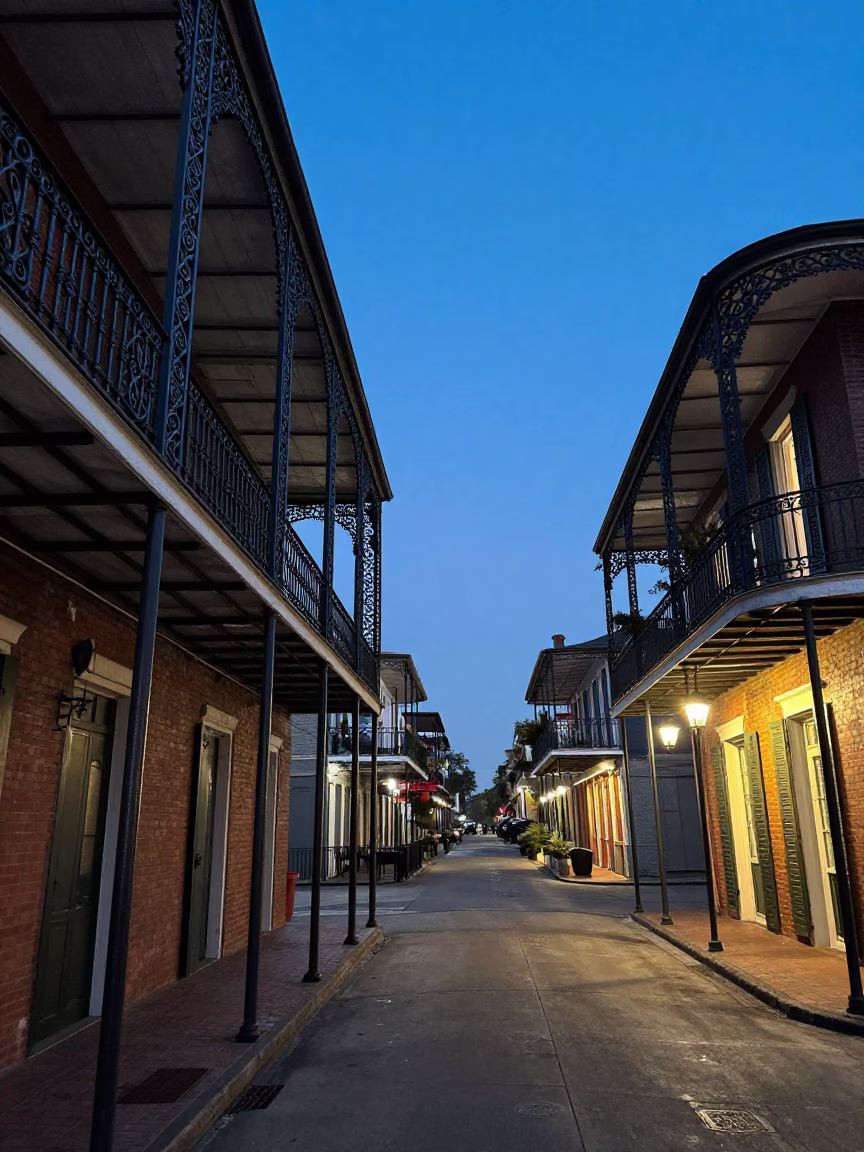 New Orleans French Quarter Indigo Twilight Street Scene with Balconies and Streetlights in in New Orleans, Louisiana, United States