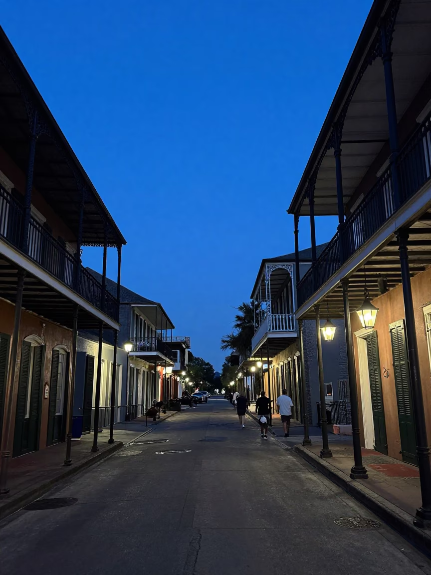 New Orleans French Quarter indigo twilight street scene with wrought iron balconies and lanterns in in New Orleans, Louisiana, United States