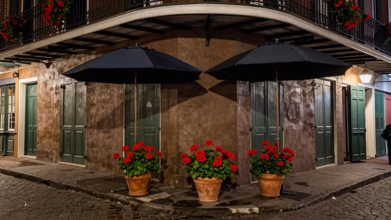 New Orleans Night Street Scene with Umbrellas and Potted Geraniums in in New Orleans, Louisiana, United States
