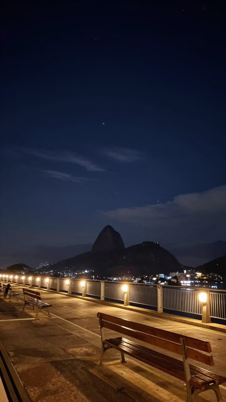 Night Bridge Lights Benches Rio Stars in beneath thin cloud gaps and stars in Rio de Janeiro state