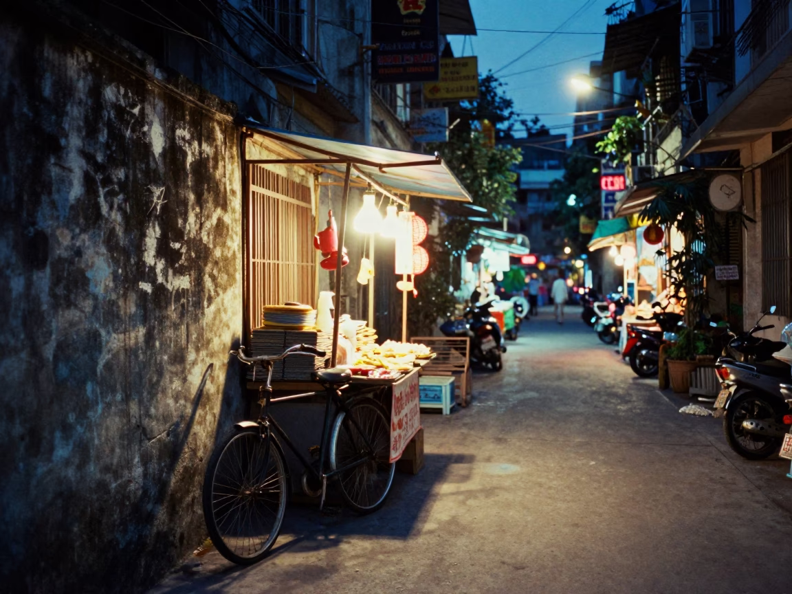Night Market Stall in Hanoi Vietnam with Bicycle and Urban Lighting in in Hanoi, Vietnam