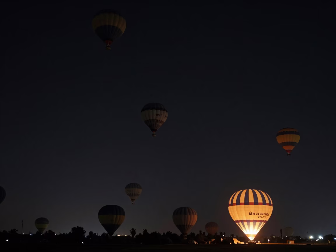 Night Sky Over Luxor Egypt With Hot Air Balloon Fleet Silhouettes Against Dark Horizon in in Luxor, Egypt