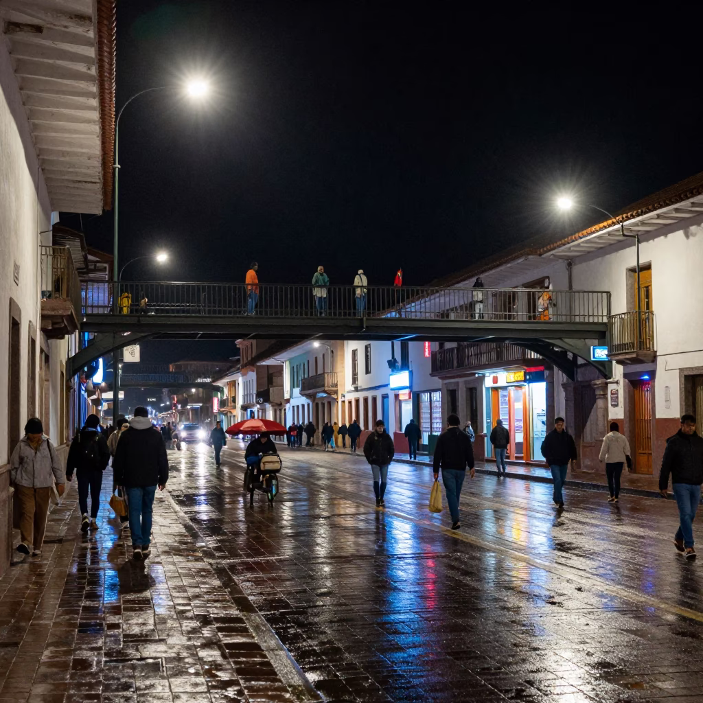 Night Street Scene in Cusco Peru With Pedestrian Overpass And Wet Footsteps in in Cusco, Peru