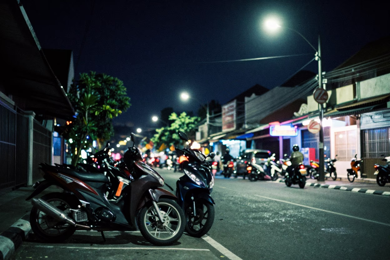 Night Street Scene in Denpasar Indonesia with Motorcycle and Neon Lights in in Denpasar, Indonesia