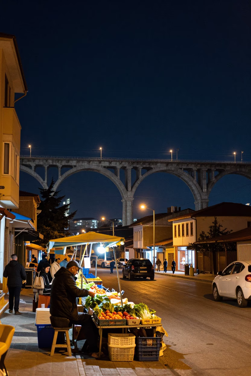 Night Street Scene in Izmir Turkey with Railway Viaduct and Local Vendor in in Izmir, Turkey