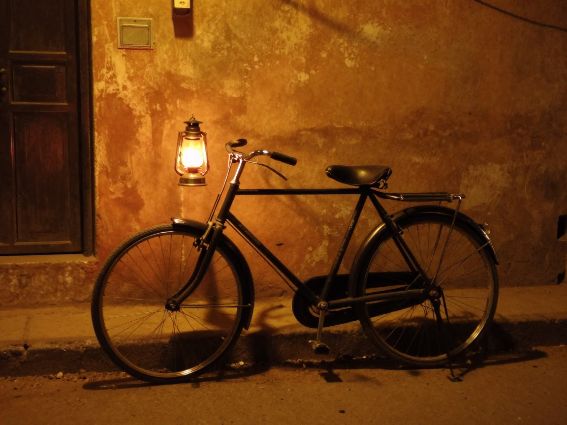Night street scene in Jaipur India with vintage bicycle and warm lantern light in in Jaipur, India