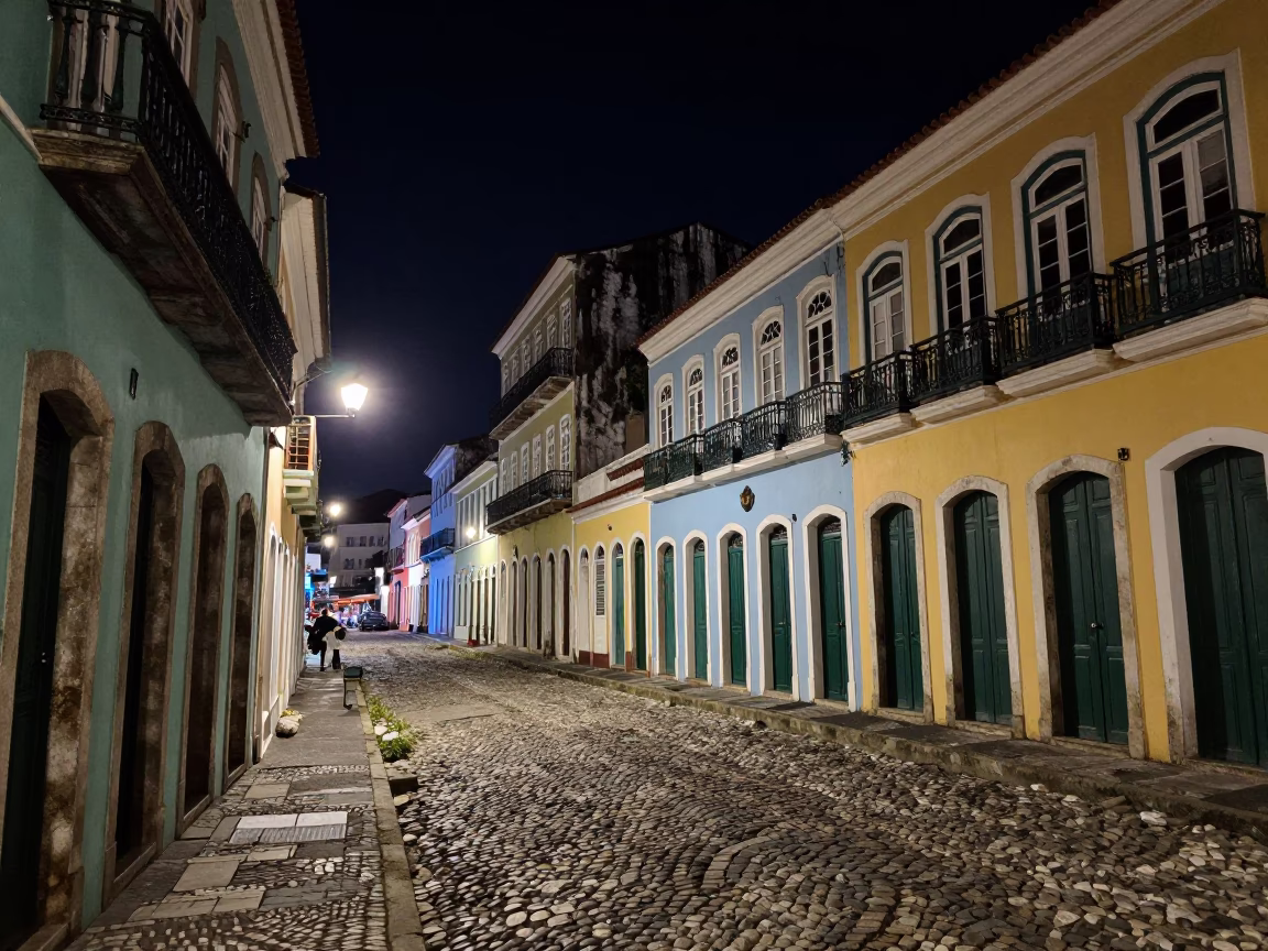 Night street scene in Salvador Brazil with colorful colonial architecture and local street vendor in in Salvador, Brazil